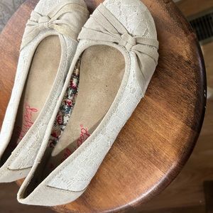 Women’s lace and tan flats